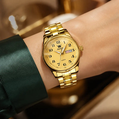 Montre femme OLEVS Colette dorée portée au poignet, cadran doré et bracelet en acier